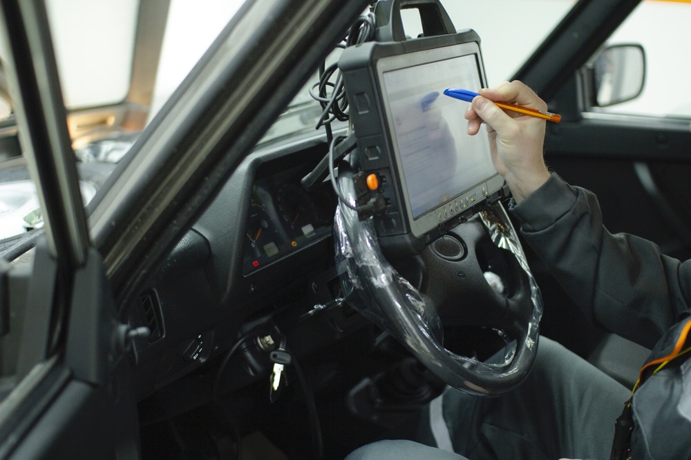 Professional car mechanic working in a service station.