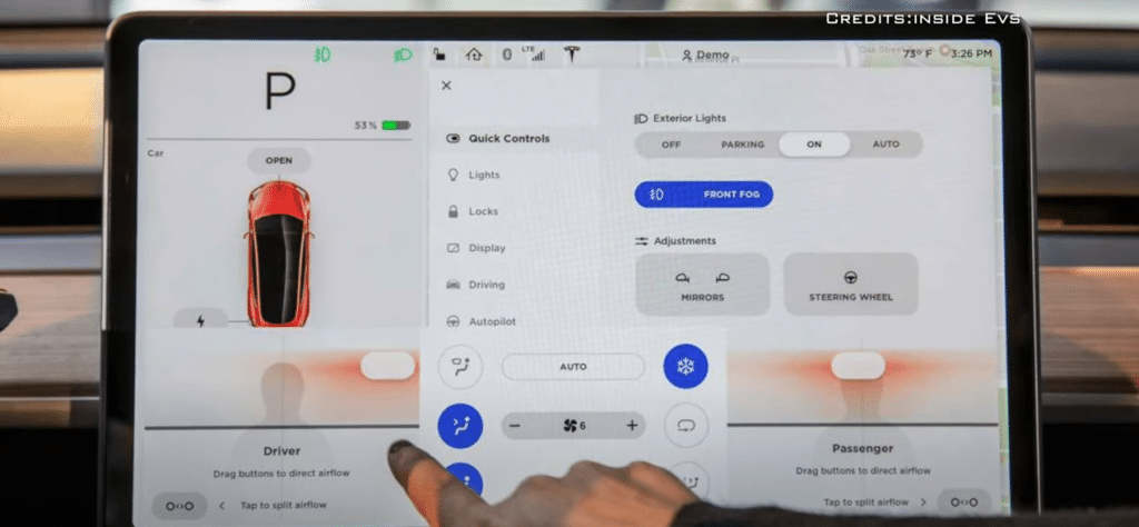 Tesla Model S parked with energy app monitoring battery status